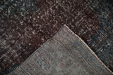 Distressed vintage Sparta runner, its worn pile revealing woven foundation and machine-bound edge.