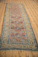 Antique Northwest Persian runner with geometric guls, sky blue meandering border, dusty olive minor borders.