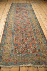 Geometric guls, sky blue boteh borders, and fringe on an antique Persian runner.