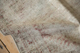 Distressed texture with visible foundation, ivory, faded red, and pale blue pile.