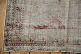 Heavily worn corner of an antique Distressed Mahal rug runner, revealing foundation and faint red motifs.