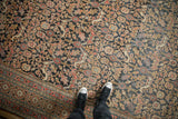 Section of antique Khorassan carpet showcasing dragon arabesques, Herati motif, and softened madder red, navy, and gold.