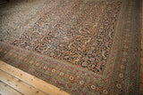 Antique Khorassan border with madder root red florals and intricate vinery field.