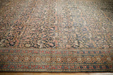 Antique Persian Khorassan rug border, red and blue floral motifs, dark field wear.