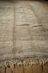 Thick plush beige and sand fringe on the secured end of the Moroccan rug.