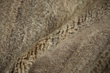 Thick, plush texture of the vintage Moroccan carpet pile in natural beige, sand, and greige.