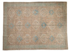 Distressed vintage Karaja carpet, geometric medallions in pale apricot and sky blue.