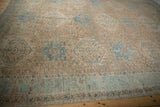 Distressed Karaja carpet border and geometric field in pale apricot, sky blue with faint foundation.