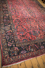 Vintage Lilihan rug corner with ivory fringe, dark navy blue border and scrolled floral pattern.