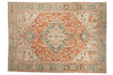 Vintage distressed Heriz carpet with a concentric starburst medallion in terracotta and dusty powder blue.