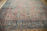Distressed Lilihan carpet border showcasing sapphire blue palmettes, pomegranates, and cherry red details.