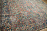 Distressed Lilihan carpet main border showing pomegranates, palmettes, ruby, and sapphire tones.
