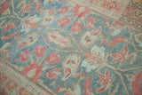 Evenly worn pile of a vintage Malayer rug with paisley botehs in denim and raspberry.