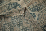Evenly worn pile and tightly woven back of a hand-knotted vintage Ersari carpet at the corner.