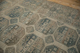 Even wear across the low-pile texture reveals the geometric gul motifs of the carpet.