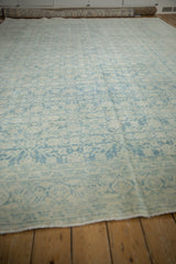 Distressed vintage Mahal carpet detail: faded powder blue Herati pattern and turtle border.