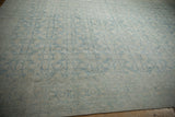 Distressed Persian Mahal with faded Herati pattern, light blue, and visible foundation.