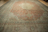 A long perspective view showing the scale and tea-washed patina of a vintage Kayseri carpet.