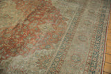 Low-pile texture and color abrash on a distressed Kayseri carpet with rust and silver floral motifs.