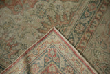 Vintage Kayseri rug corner folded back, contrasting the face's patina with the brilliant reverse.