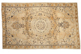 Distressed vintage Kars carpet with a concentric medallion and Rococo scrolls in ivory, gold, and charcoal.