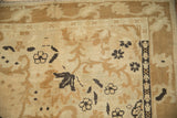 Rococo-stylized arabesques and scrolls on the evenly worn, low pile of the vintage Kars carpet.