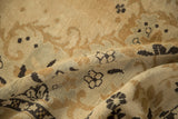 Evenly worn, low pile texture of a vintage Kars carpet with dusty gold scrolls.