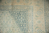 Distressed Tabriz rug corner with stepped, inverted dusty teal blue Herati spandrel.