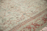 Angled view of the distressed Anatolian carpet's low-pile texture and turtle Samovar design.