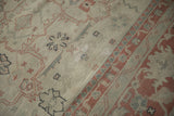 Detail of the distressed hand-knotted pile, showing visible knot heads and areas of repair.