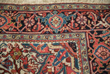 Corner spandrel and detailed borders of a vintage Ahar carpet showing the dense, fine wool pile.