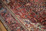 Corner spandrel detail on a vintage Ahar carpet showing serrated leaf motifs.