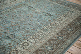 Intricate serrated leaves and aqua abrashes on distressed vintage Persian Qom rug.