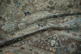 Distressed overdyed Qom carpet with faded aquatic blue floral motifs and worn pile texture.