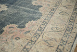 Distressed vintage Turkish Sparta rug detail, showing dusty blue field and soft pink palmette motifs.