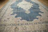 Distressed dusty cobalt blue field and pink palmette corner spandrel.