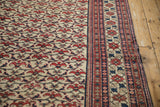 Vintage Baktiari carpet's brick red floral bat field and cobalt blue, pomegranate leaf border.