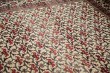 Vintage Persian Baktiari carpet: brick red floral bat design with patina on ivory field.