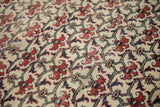 Vintage Baktiari traditional carpet detail: brick red floral bat motif, cobalt blue lattice, subtle wear.