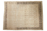 Distressed vintage Persian Meshed carpet with faded sandalwood floral motifs, faint foundation visible, 9'6