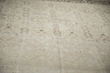 Distressed vintage Meshed rug pile, showing faded sandalwood tones and worn texture.