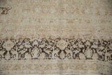Distressed vintage Meshed carpet pile showing faded sandalwood quatrefoil patterns and exposed foundation.