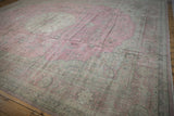 Distressed pink Turkish Sparta rug featuring time-softened ivory and silver floral border.