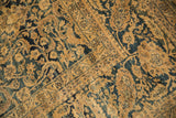 Distressed vintage Meshed carpet showing dusty gold, deep blue palmettes and worn pile.