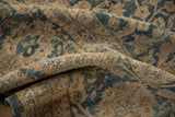 Soft, distressed pile of the vintage Meshed carpet, revealing muted blue floral palmettes.