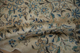 Textured pile of the Vintage Kerman Carpet, revealing dense blue and apricot floral clusters.