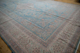 Pale sky blue distressed Meshed rug with geometric contoured border and heavy abrashes.