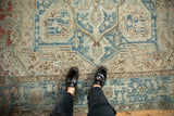 Vintage Distressed Mehrivan carpet with heavy abrashes, ivory, and pale blue geometric motifs.