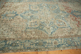 Distressed Mehrivan carpet detail: abrashed pale blue, ivory, and terracotta geometric motifs.