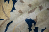 Vintage Tibetan carpet pile with plush texture and cobalt blue, saffron floral patterns.